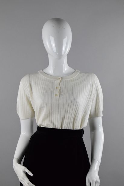null COURREGES 
Circa late 1970

White knit top with round buttoned collar. 
Short...