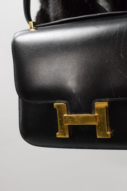null HERMES PARIS 
Circa 1970

Bag model "Mini Constance" in black box leather and...