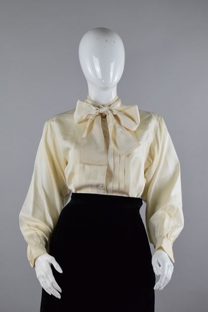 null YVES SAINT LAURENT Left Bank
Circa 1980

Tuxedo-style blouse with a matching...