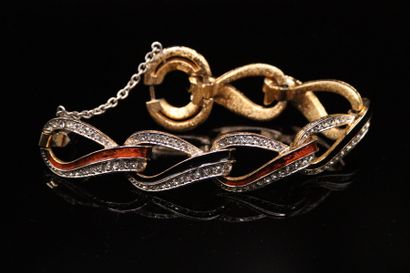 null D'ORLAN 

Gold and silver plated metal bracelet decorated with white stones...