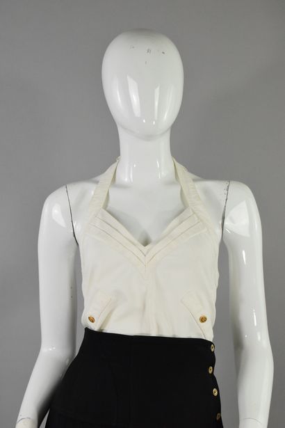 null CHANEL 
Probably Fall/Winter 1987

White top with diagonal pockets and bow-like...