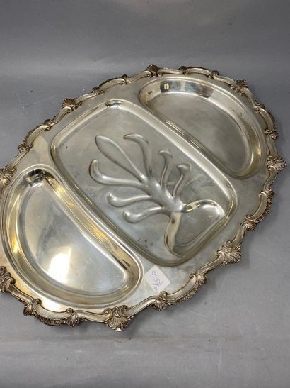 Important oval dish in silver plated metal...
