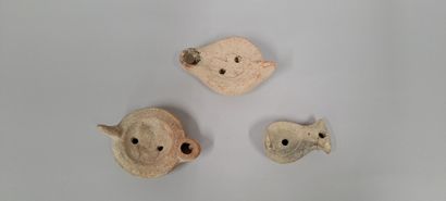 null Lot of three oil lamps, one aviform, one with a heart-shaped nozzle and one...