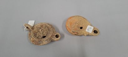 null Lot of two oil lamps, one with a round spout and straight line and one with...