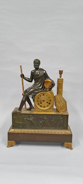 A gilt bronze clock with a medal patina representing...