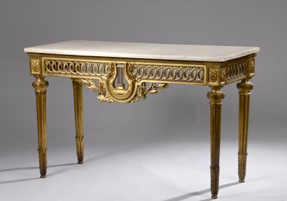 null Neoclassical console of rectangular form out of carved and gilded wood, the...