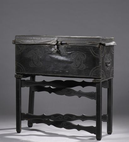 null Curious travel desk in the form of a trunk lined with leather with studded decoration...