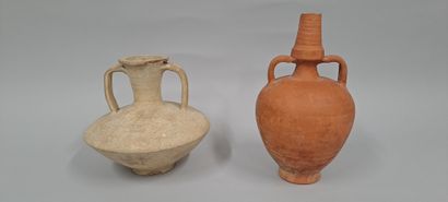 null Set of two jugs, one with a carinated body and trifid handle and one with an...