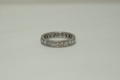 null American wedding band in platinum set with modern round diamonds.
Finger size:...