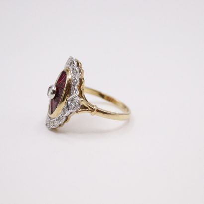 null 18k (750) yellow and white gold ring set with a diamond and calibrated rubies...