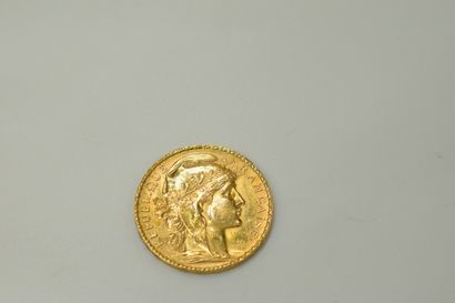 null Gold coin of 20 francs with rooster (1905).
Weight : 6.45g.