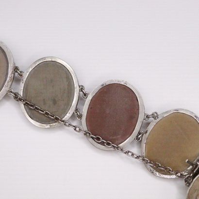 null Metal and silver bracelet holding 6 cameos in lava stone carved with female...