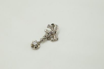 null Platinum (750) pendant forming a bow decorated with rose-cut diamonds and holding...