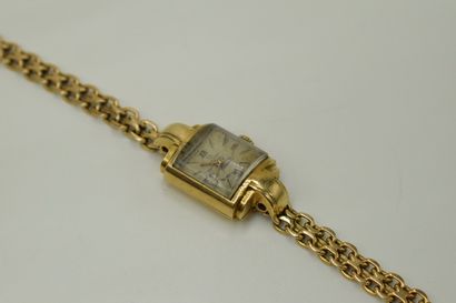 null OMEGA 
Ladies' wristwatch, rectangular case in 18K (750) yellow gold, grey dial,...