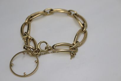 null Bracelet in 18K (750) gold with fancy mesh holding a coin mount. 
Wrist circumference...
