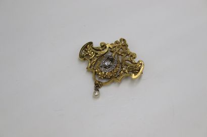 null 18K (750) yellow and white gold openwork brooch-pendant representing a garland...