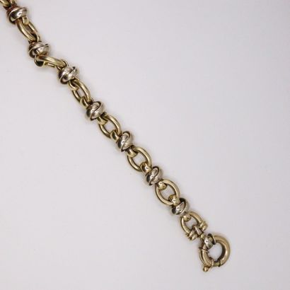 null Yellow and white gold bracelet 18k (750). 
French work. 
Wrist size : 19 cm....