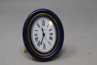 null CARTIER Paris

Gilt brass travel or desk alarm clock with blue enamelled bezel...