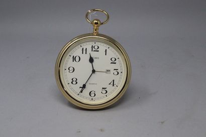 null SEIKO
Desk clock in gilt metal, in the style of a pocket watch, black Arabic...