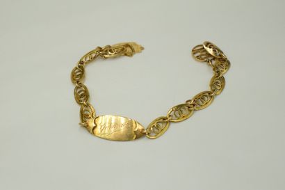 null Bracelet gourmette en or jaune 18K (750) retenant une médaille gravée "Germaine",...