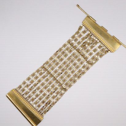 null 18K (750) yellow gold bracelet with a mesh pattern alternating between florets...