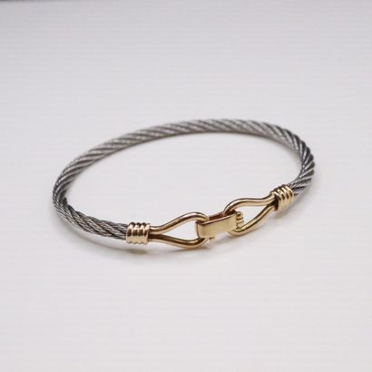null Steel and 18K (750) yellow gold bracelet. 
In the Fred style. 
Diameter : approx....