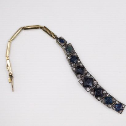 null Scrap of articulated bracelet in 18k (750) gold adorned with sapphires and small...