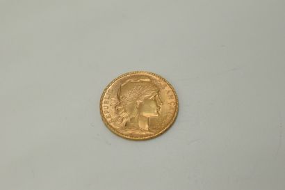 null Gold coin of 20 francs with a rooster (1906).

Weight : 6.45 g - TTB.