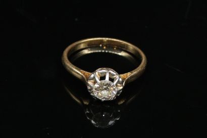 null Solitaire in 18k (750) yellow and white gold set with a diamond. 
Finger size...