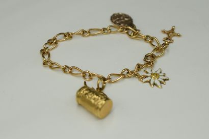 null Yellow gold bracelet 18k (750) decorated with four charms, three in gold. 
Wrist...