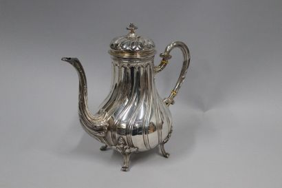 null Silver (950) ribbed coffee pot, on four feet with leaves. The handle in silver...