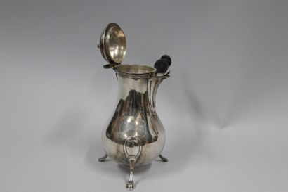 null Silver tripod coffee pot, of baluster form. The fluted spout, the balustered...