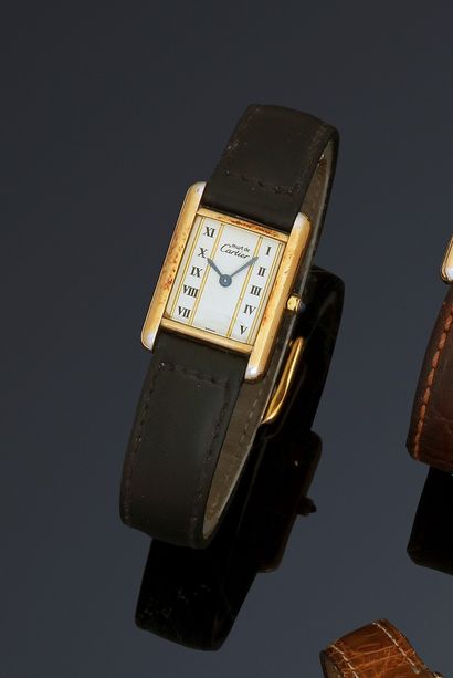 null CARTIER TANK MUST
Circa 1990
N° 80471366001
Women's bracelet watch in silver...