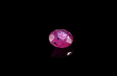 null Round ruby on paper. 
Probably not heated. 
Weight : 1.82 ct. 
Inclusions. 

Diameter...