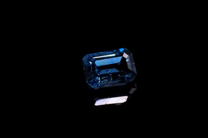 Rectangular blue topaz with cut sides on...