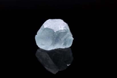 null Aquamarine rough on paper. 
Weight : 5.68 cts. 

Size: 11.5mm x 9mm