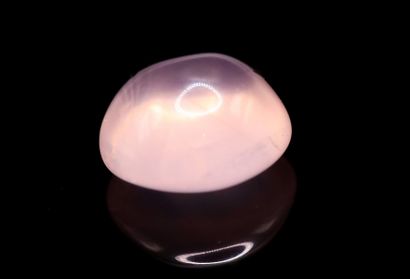 null Pink quartz cabochon on paper. 
Weight : 5.40 cts. 

Dimensions : 11.2mm x ...