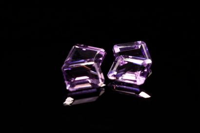 null Mixture of four rectangular amethysts with cut sides on paper. 
Total weight...