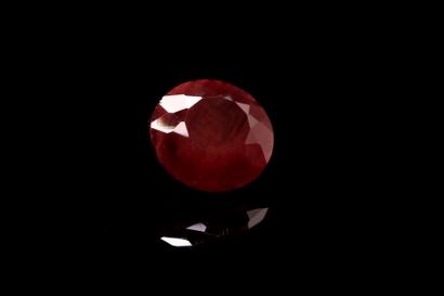 null Round red andesine on paper. 
Weight : 2.95 cts. 

Diameter : 9.8 mm