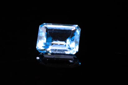Rectangular blue topaz with cut sides on...