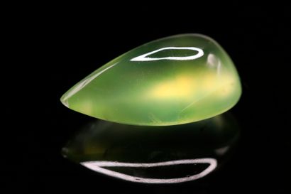 Prehnite pear cabochon on paper.
Weight :...