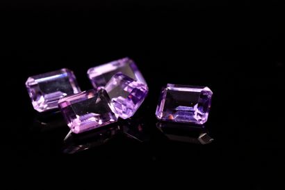 null Mixture of five rectangular amethysts with cut sides on paper. 
Total weight...