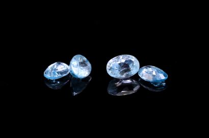 Mix of four oval blue zircons on paper.
Weight...