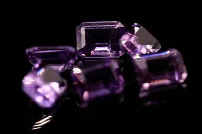 null Mixture of six rectangular amethysts with cut sides on paper. 
Total weight...