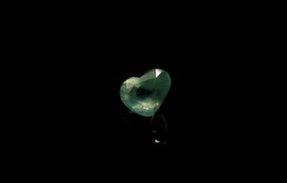 null Prehnite heart on paper. 
Weight : 2.23 cts. 

Dimensions : 8.8mm x 7.2mm