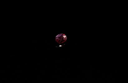 Oval ruby on paper. 
Probably not heated....