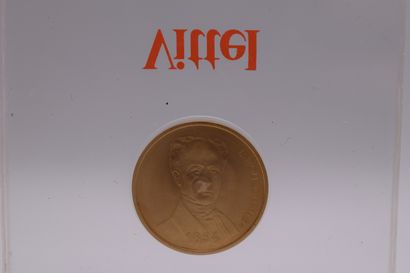 null Commemorative gold coin of Vittel celebrating 1000000000 bottles with the effigy...