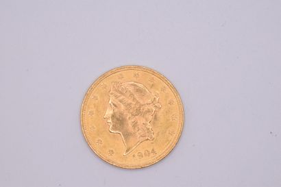 null Gold coin of 20 dollars "Liberty" (1904).
Weight : 33.43 g.