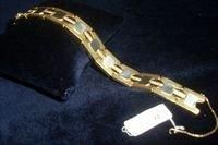 null Large bracelet articulé à motifs géométriques en or de deux tons, orné de lignes...