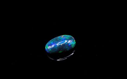 Black oval cabochon opal. 
Weight: 1.96 ct.

Dimensions:...
